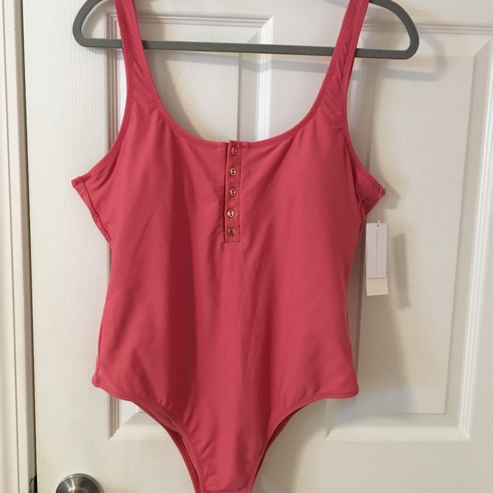 Raisins, Pink/red one piece swimsuit.